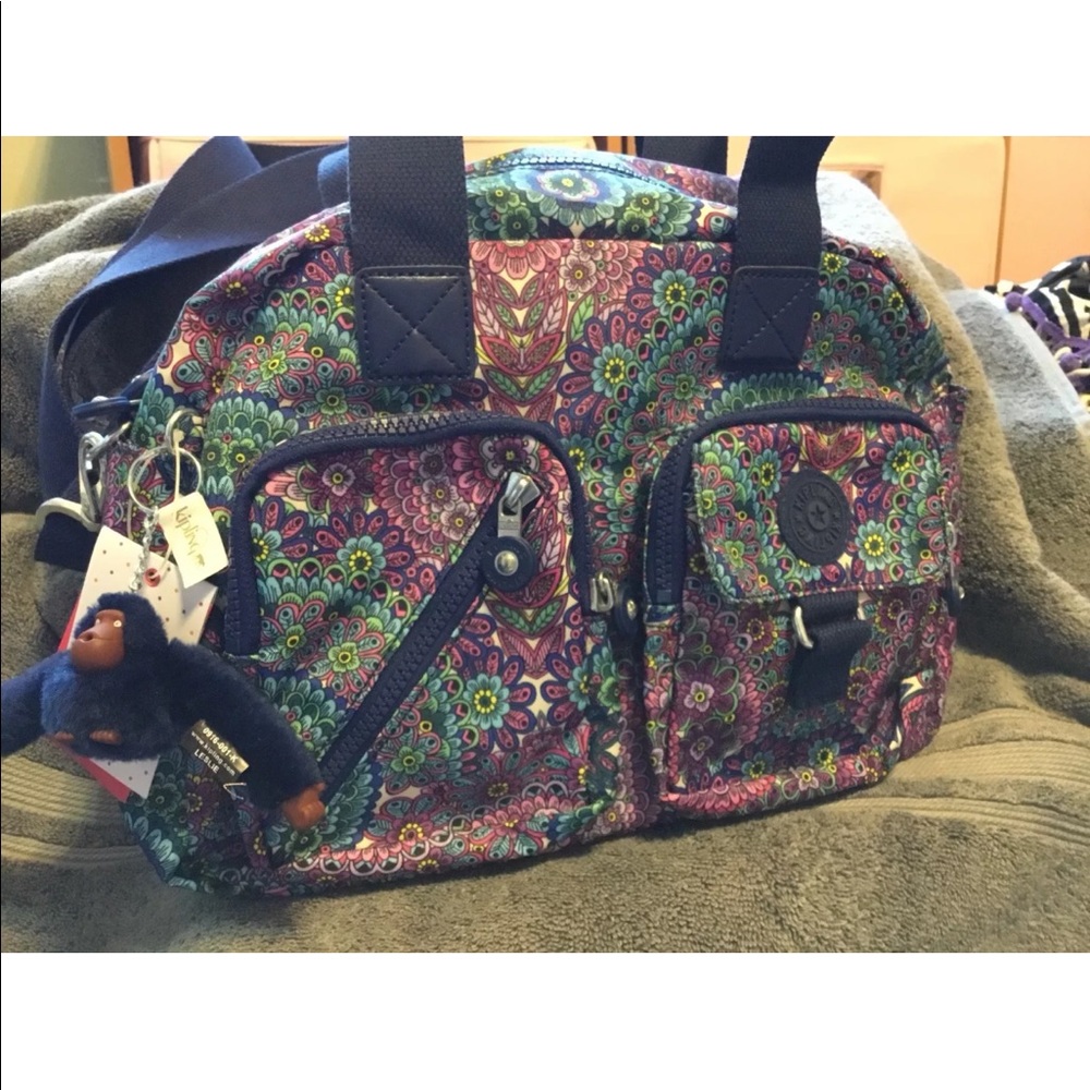 New with tag’s Kipling Defea purse, purple paisley